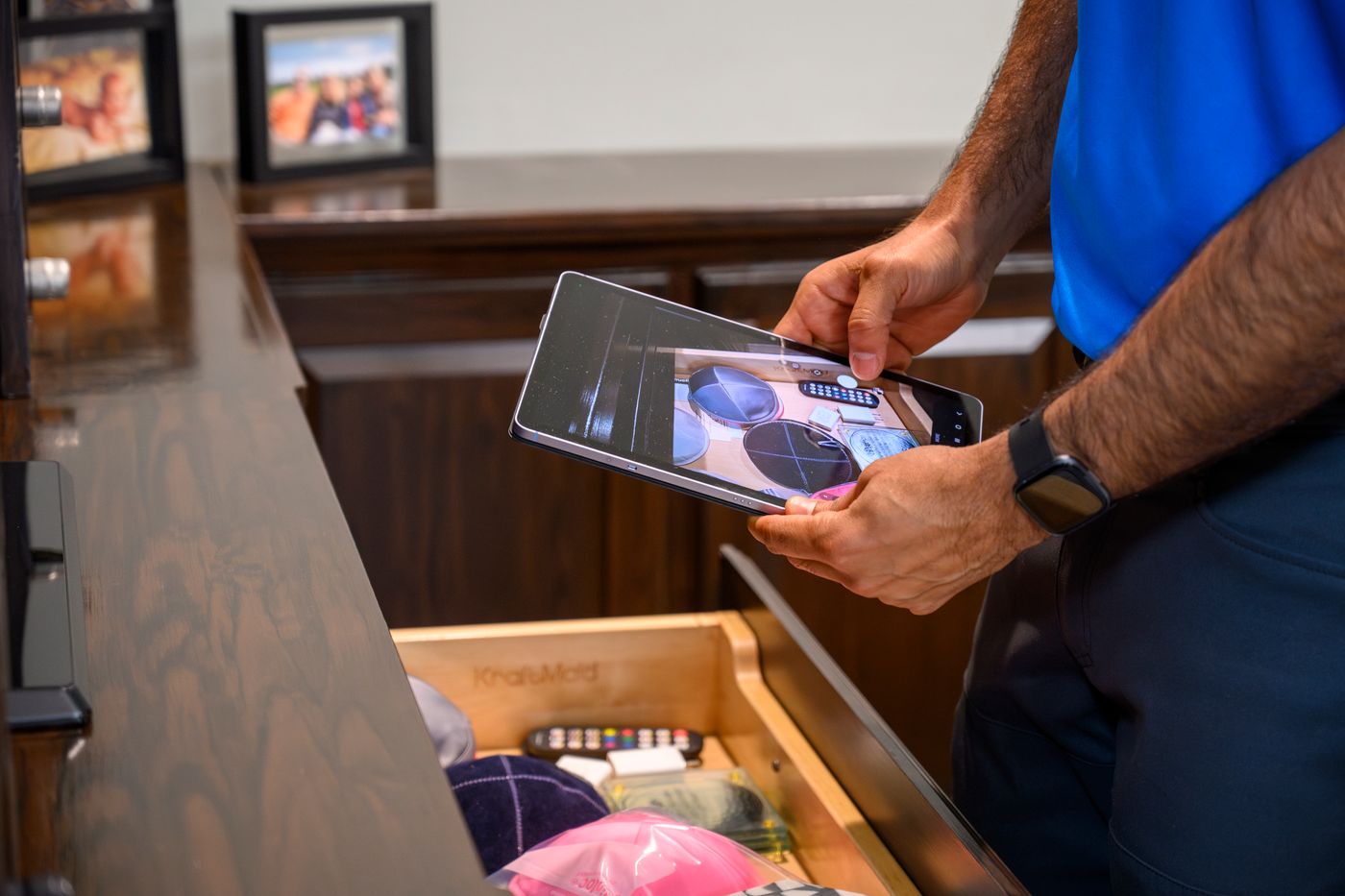 Technician photographing items for inventory documentation